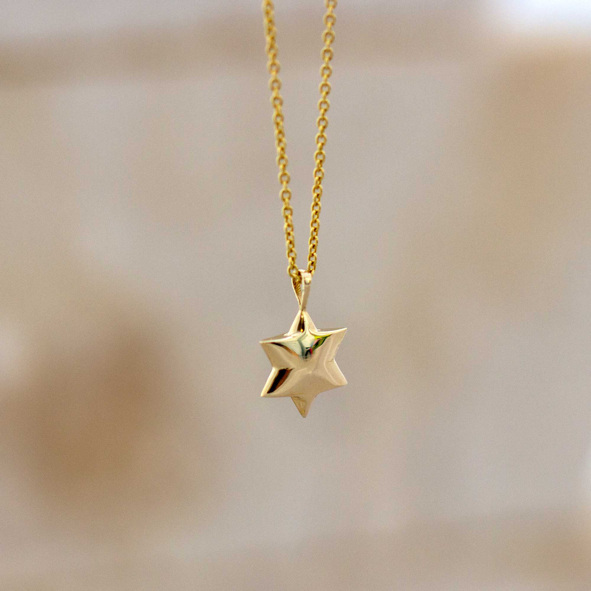 תליון מגן דוד מזהב